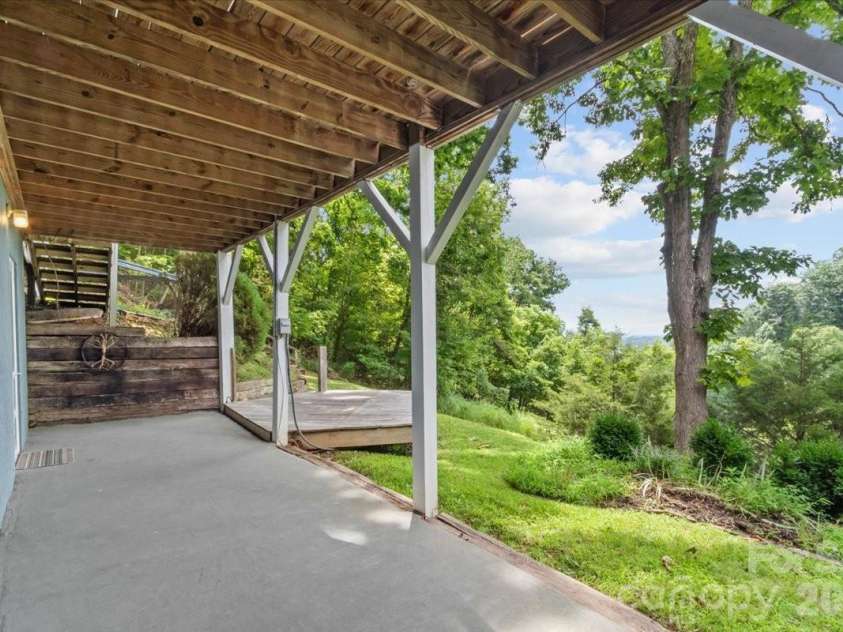 386 Madison Heights Drive, Marshall, NC 28753.  MLS# CAR4411731, YatesRealty ID 43767. Lower level patio/deck area
