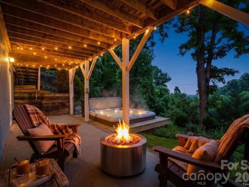 386 Madison Heights Drive, Marshall, NC 28753.  MLS# CAR4411731, YatesRealty ID 43767. Virtually staged lower level patio/deck area