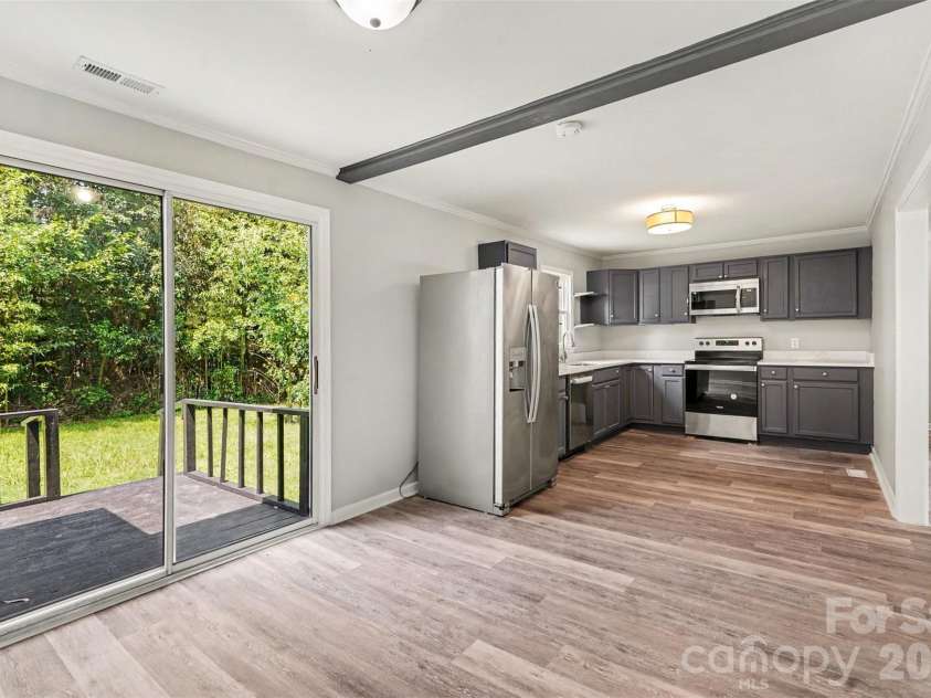 1333 Washington Lane, Kannapolis, NC 28083.  MLS# CAR4414027, YatesRealty ID 43770. Dining area looking into the kitchen - and overlooking the deck and the rear yard!