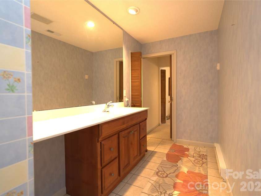 218 McGuffey Ridge Road, Gerton, NC 28735.  MLS# CAR4414157, YatesRealty ID 43771. Master bath
