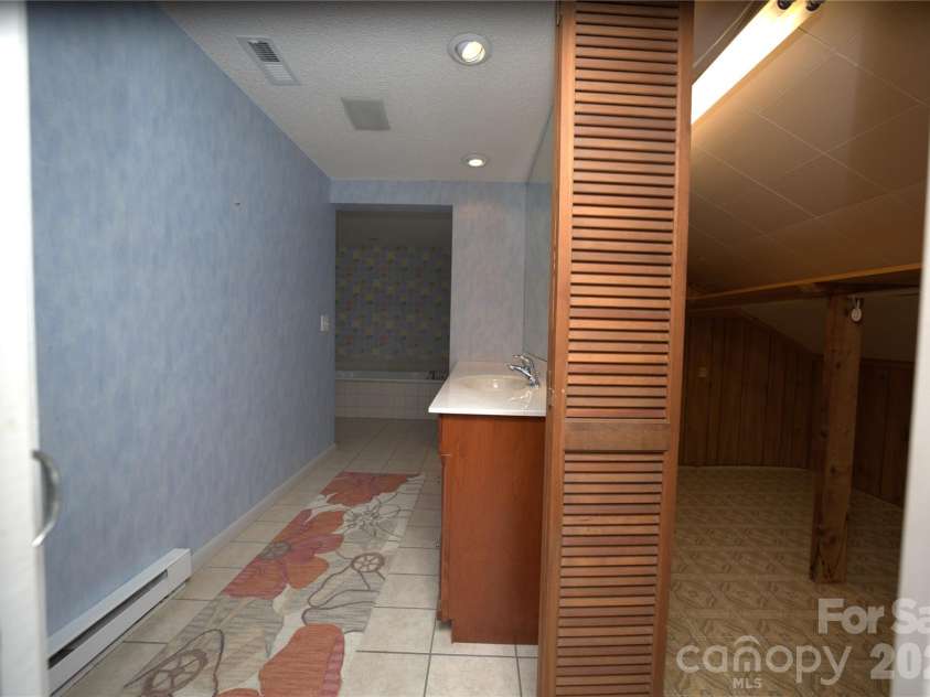 218 McGuffey Ridge Road, Gerton, NC 28735.  MLS# CAR4414157, YatesRealty ID 43771. Master Bath/Closet