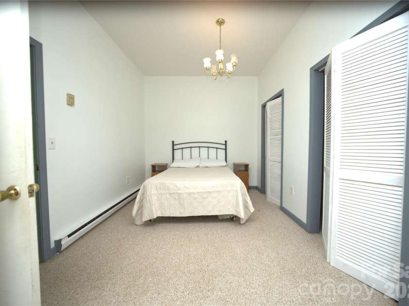 218 McGuffey Ridge Road, Gerton, NC 28735.  MLS# CAR4414157, YatesRealty ID 43771. Second bedroom in basement
