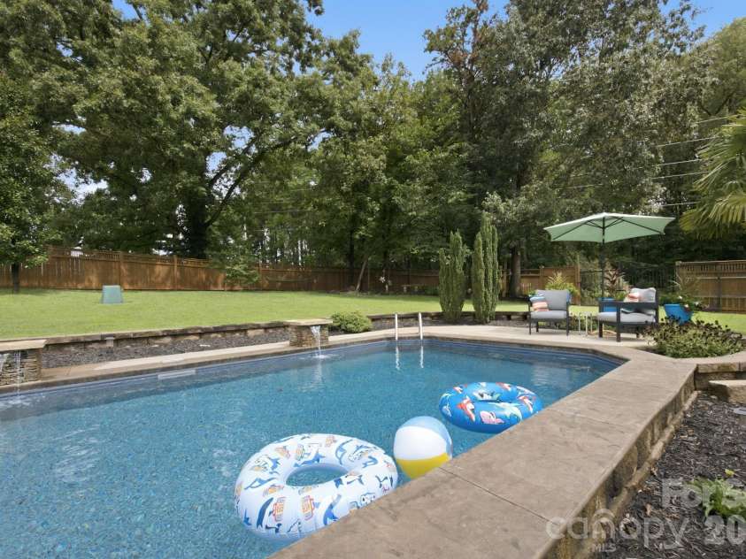 359 Huffstetler Lake Road, Dallas, NC 28034.  MLS# CAR4413475, YatesRealty ID 43785. Stone columns with waterfall features