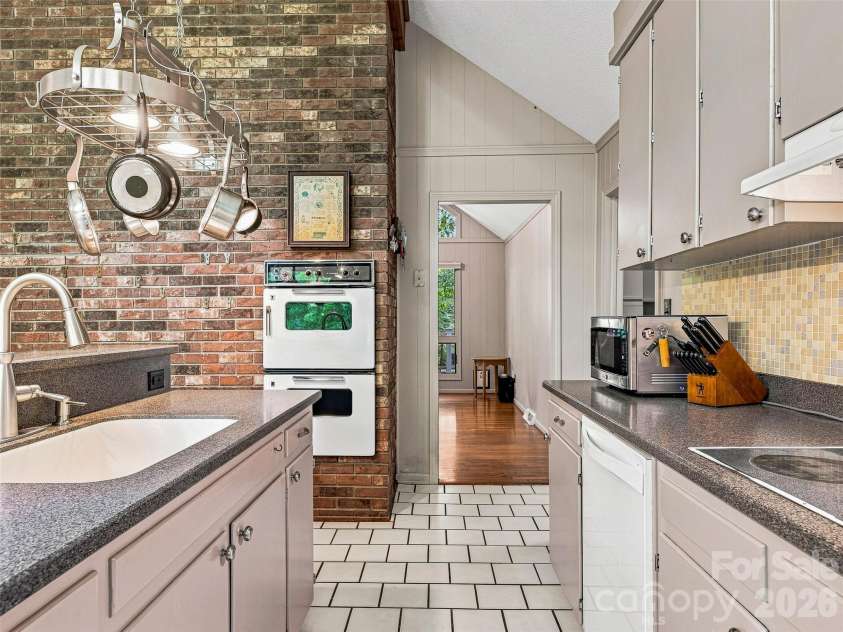 201 Valeria Lane, Pisgah Forest, NC 28768.  MLS# CAR4413829, YatesRealty ID 43787. Kitchen Looking into Living
