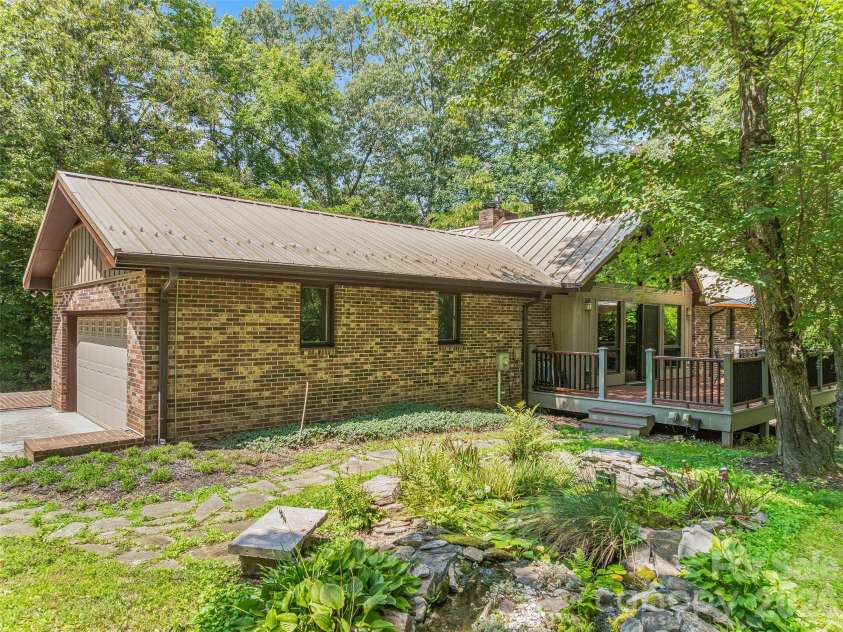 201 Valeria Lane, Pisgah Forest, NC 28768.  MLS# CAR4413829, YatesRealty ID 43787. TREX decking overlooking pond