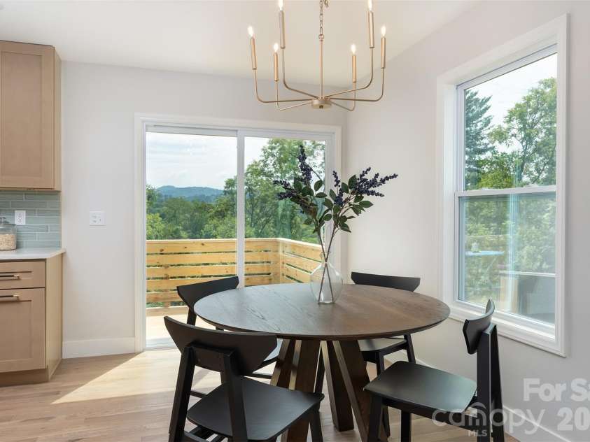 12 Crestfield Avenue, Woodfin, NC 28804.  MLS# CAR4412835, YatesRealty ID 43799. Back deck for relaxing off the dining area