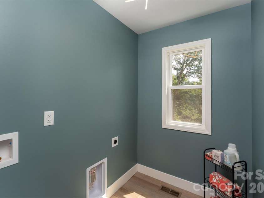 12 Crestfield Avenue, Woodfin, NC 28804.  MLS# CAR4412835, YatesRealty ID 43799. Main floor dedicated laundry space