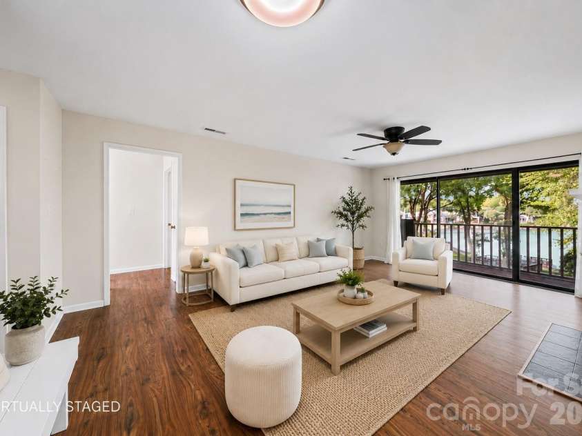 7500 Woods Lane, Cornelius, NC 28031.  MLS# CAR4413379, YatesRealty ID 43800. Living room virtually staged