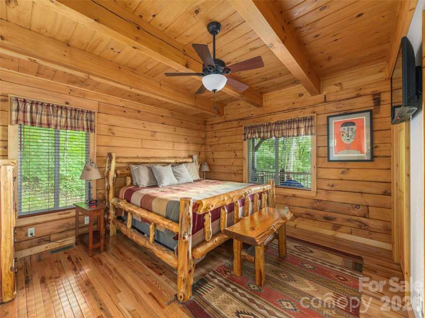 332 Gadohi Trail, Maggie Valley, NC 28751.  MLS# CAR4414080, YatesRealty ID 43811. Main level primary bedroom