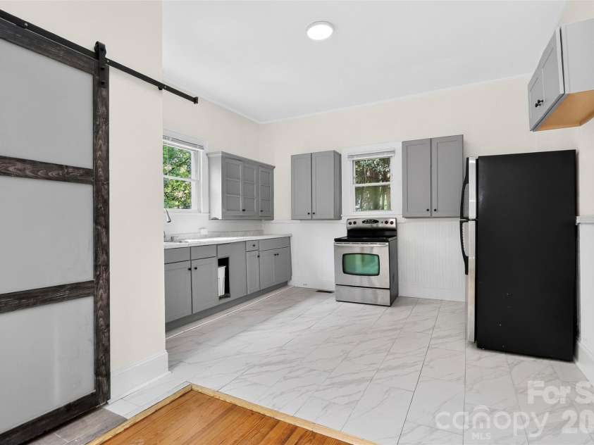 58 Skipwith Street, Concord, NC 28025.  MLS# CAR4413549, YatesRealty ID 43818. Kitchen + Laundry Room Adjacent