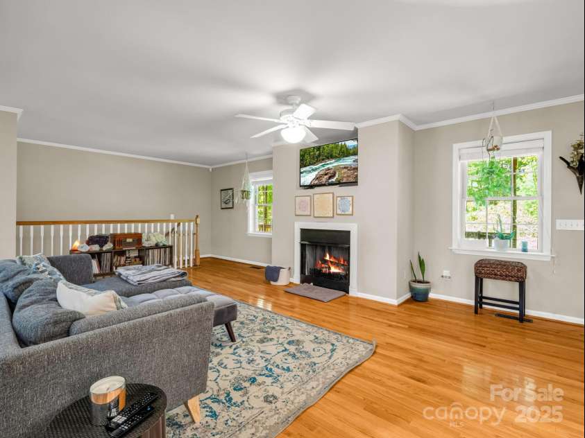 288 Long Ridge Road, Old Fort, NC 28762.  MLS# CAR4297306, YatesRealty ID 4382. Living room with gas fireplace