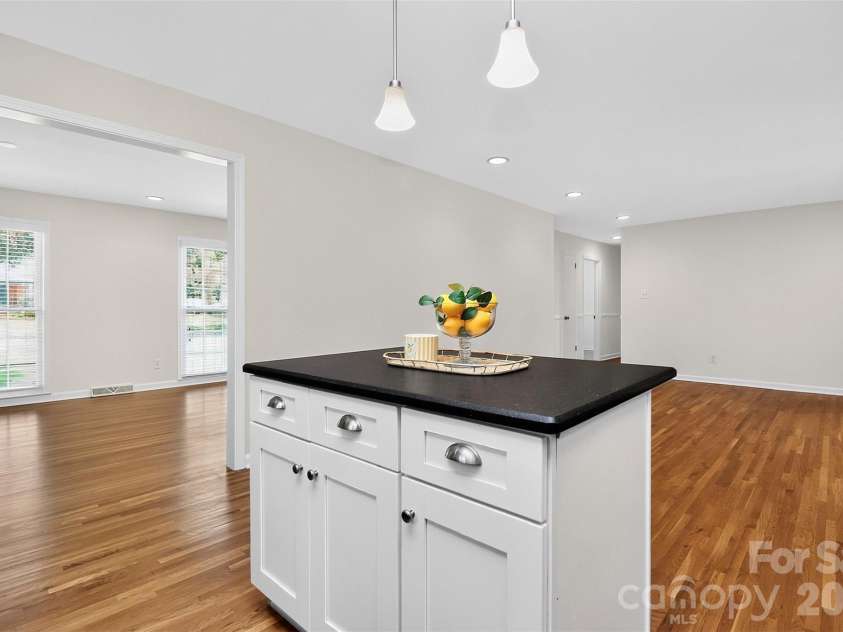 4726 Walden Court, Charlotte, NC 28210.  MLS# CAR4408855, YatesRealty ID 43826. Kitchen island with view into dining room
