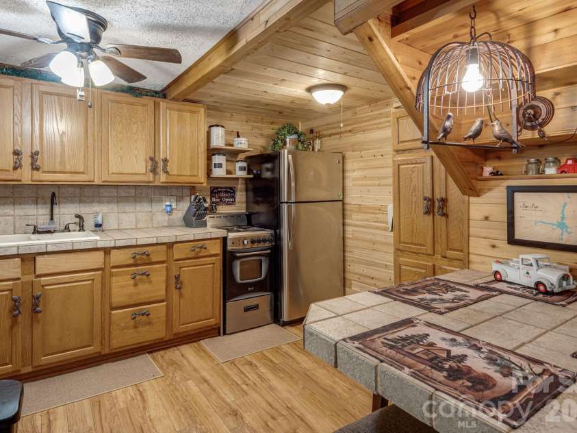 242 Whitney Boulevard, Lake Lure, NC 28746.  MLS# CAR4414218, YatesRealty ID 43829. 