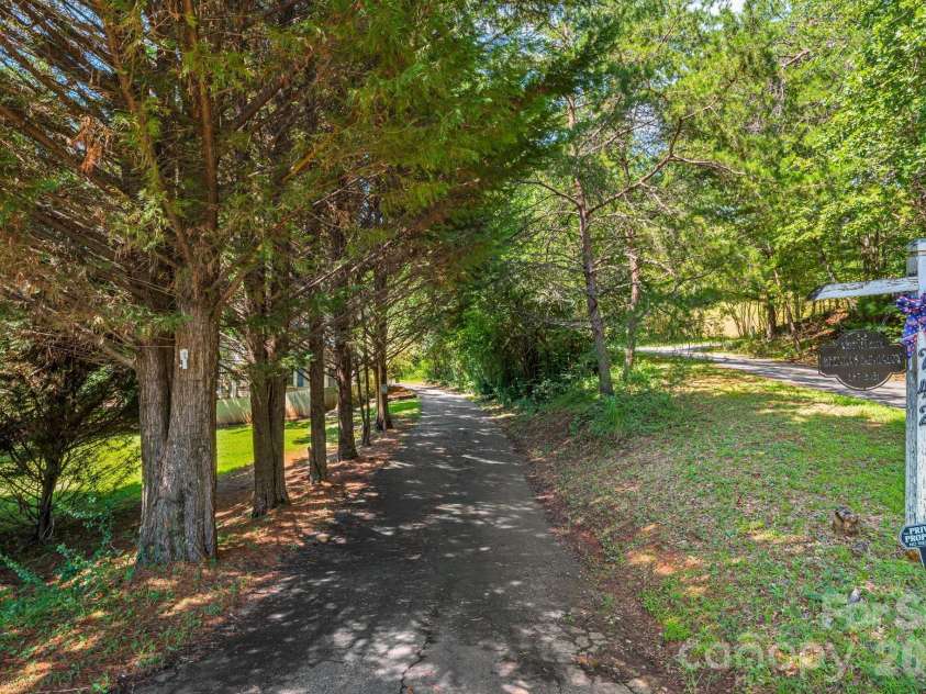 242 Whitney Boulevard, Lake Lure, NC 28746.  MLS# CAR4414218, YatesRealty ID 43829. 