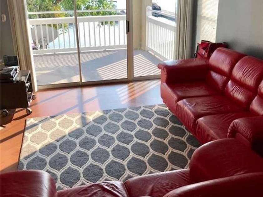 1341 Torrence Circle, Davidson, NC 28036.  MLS# CAR4238137, YatesRealty ID 4383. Living room to balcony