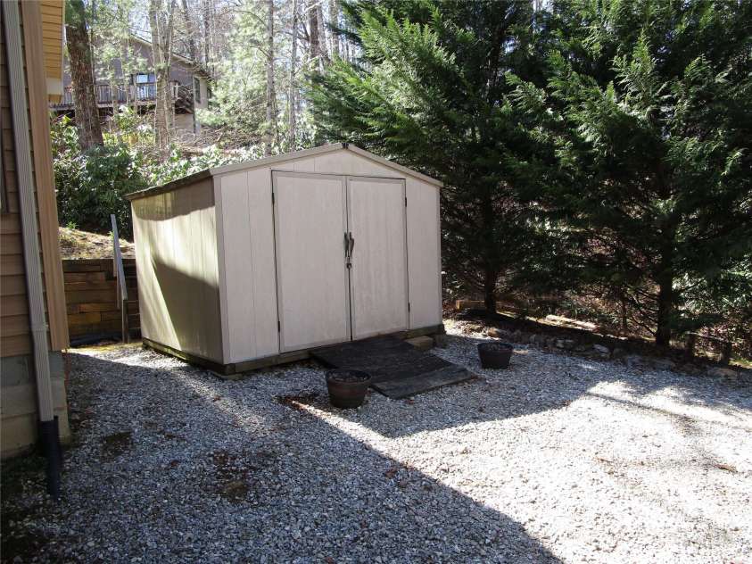 116 Minerva Lane, Sapphire, NC 28774.  MLS# CAR4237813, YatesRealty ID 4384. Backyard shed