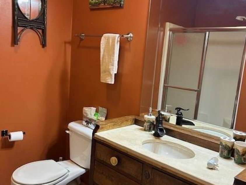 116 Minerva Lane, Sapphire, NC 28774.  MLS# CAR4237813, YatesRealty ID 4384. Guest bathroom