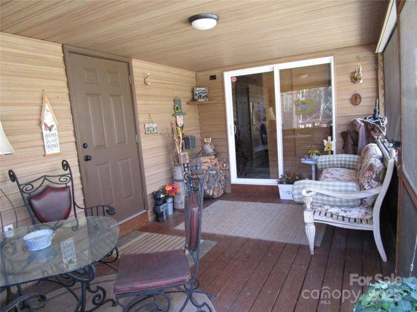 116 Minerva Lane, Sapphire, NC 28774.  MLS# CAR4237813, YatesRealty ID 4384. Screened porch entry
