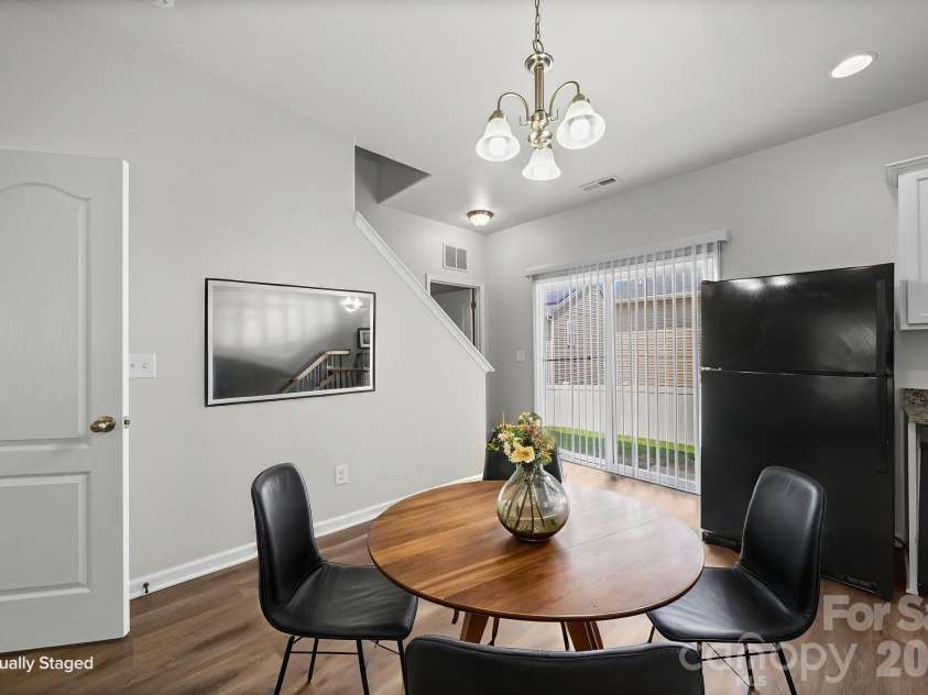 6013 Vista Woods Lane, Charlotte, NC 28215.  MLS# CAR4413340, YatesRealty ID 43842. Kitchen and Dining Room - Virtually Staged