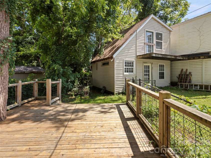 122 Edwards Avenue, Swannanoa, NC 28778.  MLS# CAR4413077, YatesRealty ID 43859. Rear deck and outbuilding