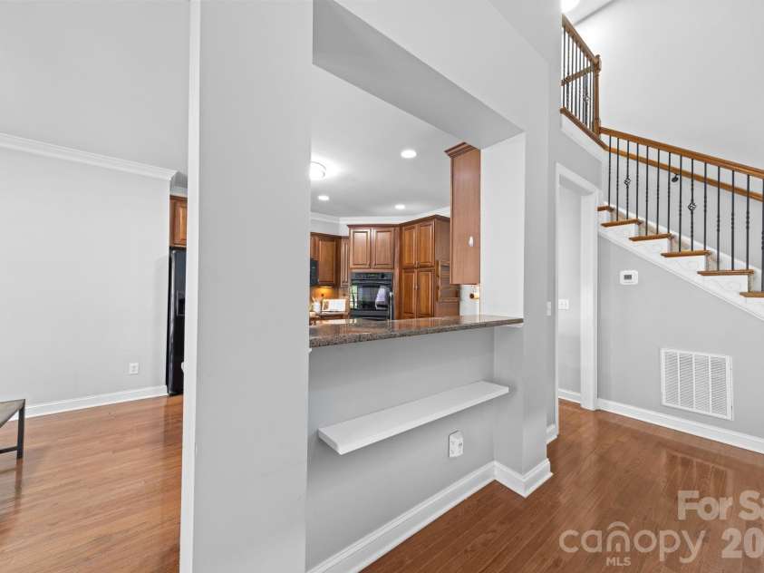 217 Edenshire Court, Indian Trail, NC 28079.  MLS# CAR4342987, YatesRealty ID 4387. Kitchen Overlooks Living Room