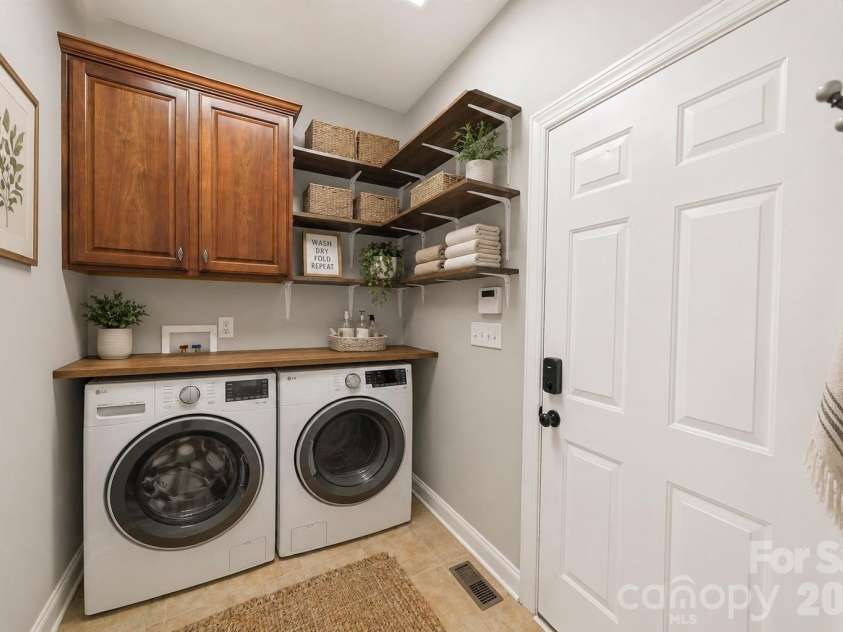 217 Edenshire Court, Indian Trail, NC 28079.  MLS# CAR4342987, YatesRealty ID 4387. Virtually Staged Laundry on main floor