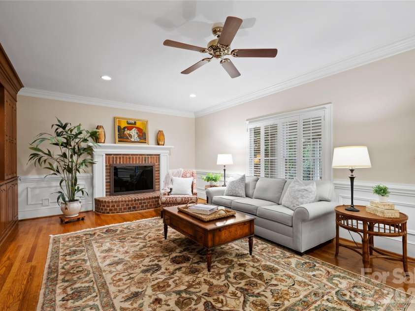 4026 Sharon View Road, Charlotte, NC 28226.  MLS# CAR4346910, YatesRealty ID 4390. A brick fireplace anchors the great room. 