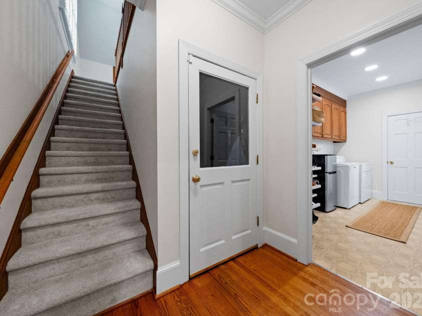 4026 Sharon View Road, Charlotte, NC 28226.  MLS# CAR4346910, YatesRealty ID 4390. Stairway from kitchen area to bonus room.