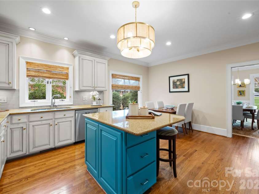 4026 Sharon View Road, Charlotte, NC 28226.  MLS# CAR4346910, YatesRealty ID 4390. The kitchen is the heart of this home. The island shows much bluer in the photo than in real life.