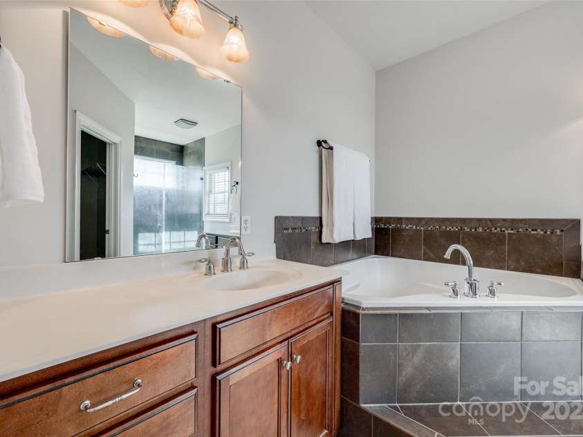 1790 Faires Road, Rock Hill, SC 29730.  MLS# CAR4235758, YatesRealty ID 4393. Primary bathroom features a large tub and plenty of storage.