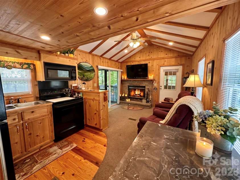 21 Bear Cub Drive, Spruce Pine, NC 28777.  MLS# CAR4410886, YatesRealty ID 43949. Kitchen - Living Room open concept - Ai Decor