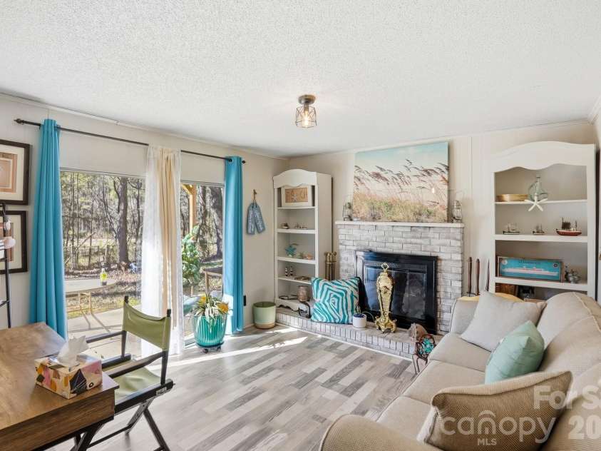 343 Carr Road, Dallas, NC 28034.  MLS# CAR4332893, YatesRealty ID 4395. Family room has access to back porch and yard. Seller has not used fireplace in many years--sold as is.