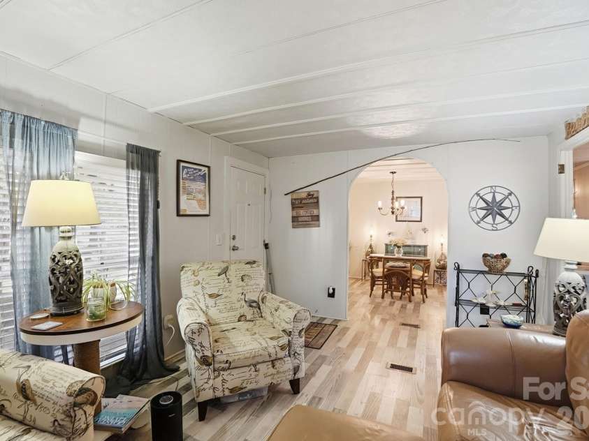 343 Carr Road, Dallas, NC 28034.  MLS# CAR4332893, YatesRealty ID 4395. Note the rounded arch doorway looking into the dining room from the living room