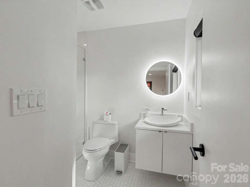 811 Lansdowne Road, Charlotte, NC 28270.  MLS# CAR4412881, YatesRealty ID 43958. Bathroom with floating vanity.