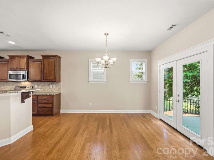 3016 Connells Point Avenue, Waxhaw, NC 28173.  MLS# CAR4413971, YatesRealty ID 43964. Doors open to patio from the breakfast area