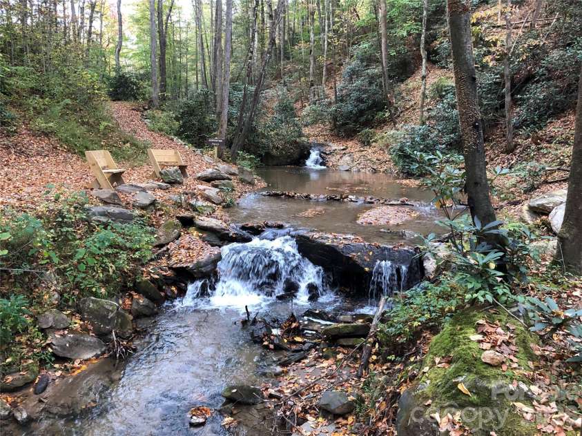 1987 Buck Mountain Road, Purlear, NC 28665.  MLS# CAR4394958, YatesRealty ID 43974. The Oasis at Tranquility Falls