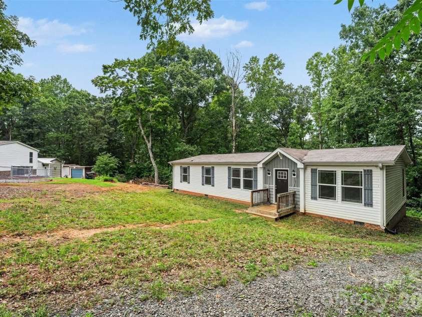 2998 Wilderness Trace, Claremont, NC 28610.  MLS# CAR4413940, YatesRealty ID 43985. Front Exterior & Yard