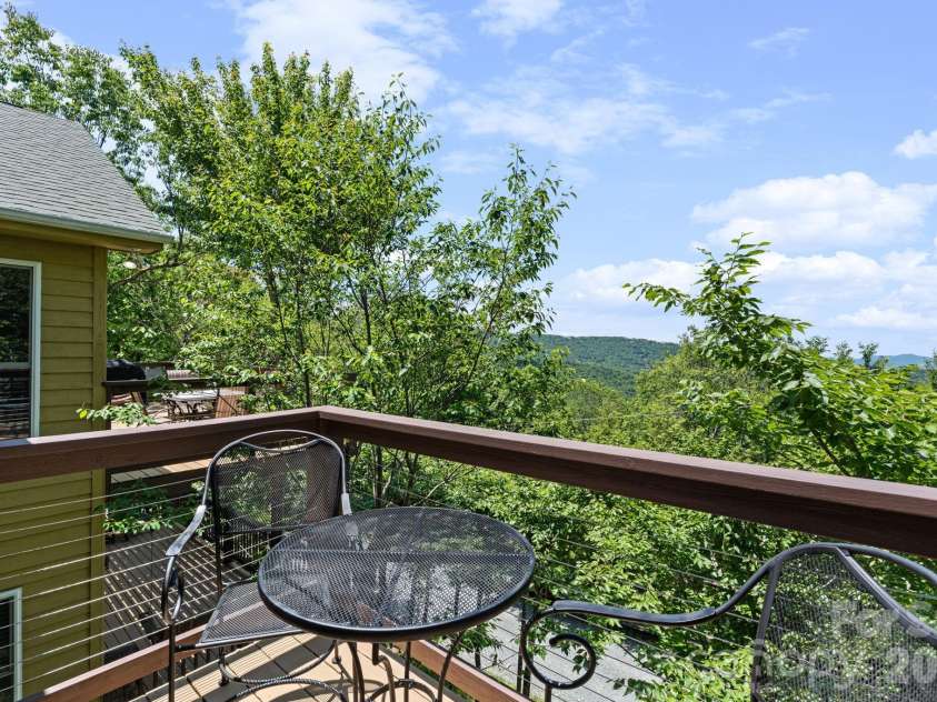 117 Pinnacle Ridge Road, Beech Mountain, NC 28604.  MLS# CAR4390771, YatesRealty ID 43995. Morning deck off primary bedroom upper level