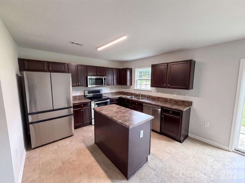802 Bartram Avenue, Concord, NC 28025.  MLS# CAR4414533, YatesRealty ID 44004. Staged Photo