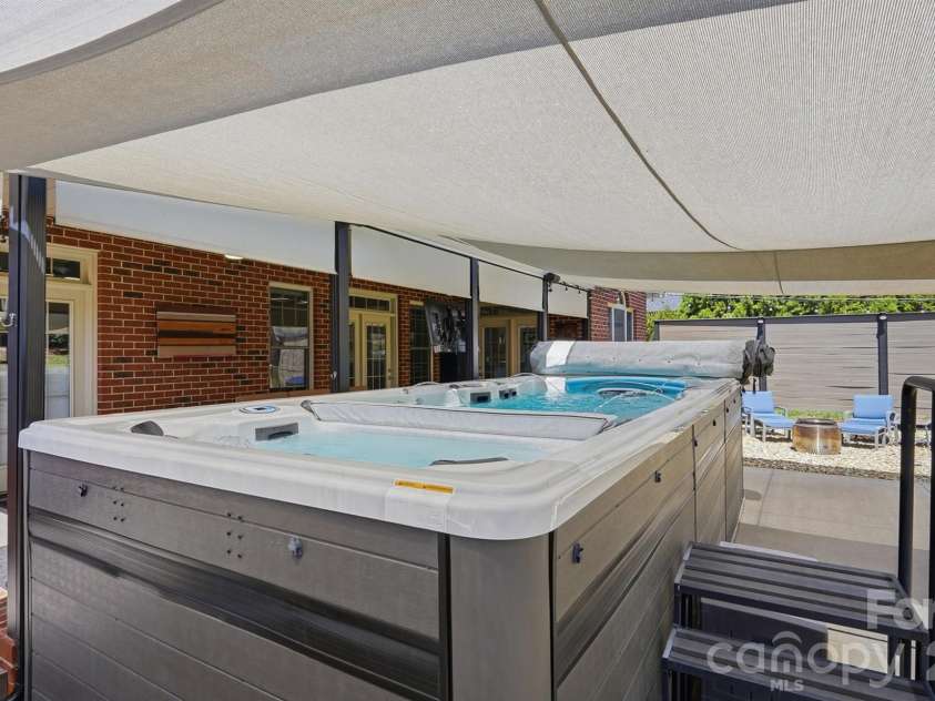 2712 Smith Field Drive, Monroe, NC 28110.  MLS# CAR4410000, YatesRealty ID 44005. Canopy over the Patio & Pool/Spa