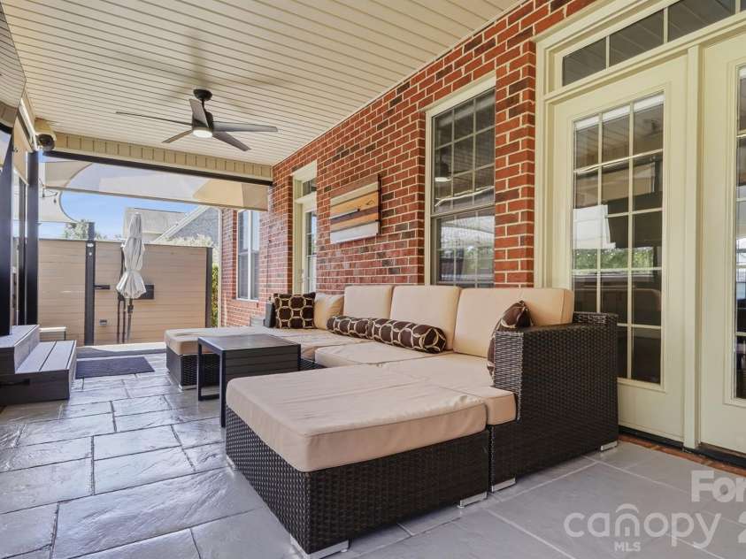2712 Smith Field Drive, Monroe, NC 28110.  MLS# CAR4410000, YatesRealty ID 44005. Custom Covered Patio with Ceiling Fans and Blinds