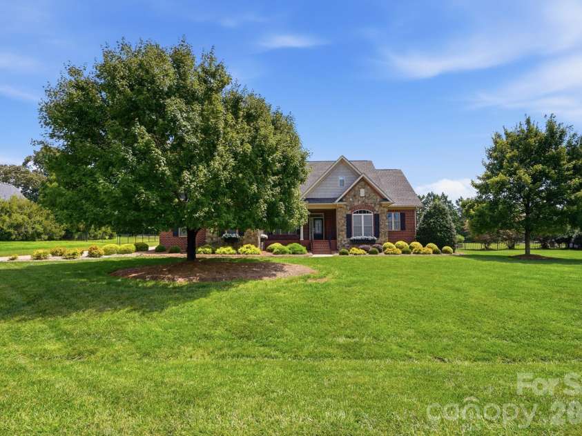 2712 Smith Field Drive, Monroe, NC 28110.  MLS# CAR4410000, YatesRealty ID 44005. Custom Home on almost an Acre Lot