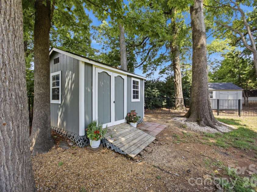 15121 Castlebridge Lane, Matthews, NC 28104.  MLS# CAR4408542, YatesRealty ID 44006. Backyard Sheds