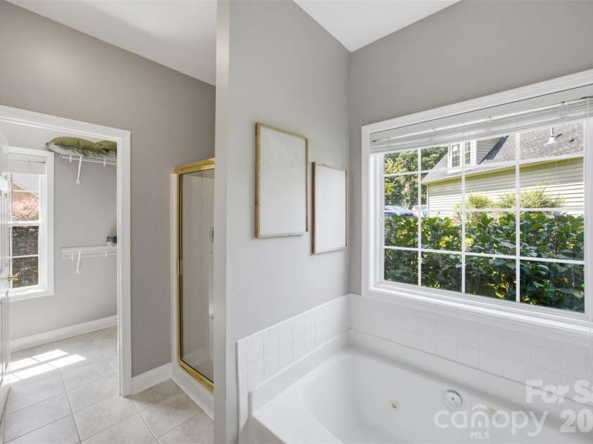 15121 Castlebridge Lane, Matthews, NC 28104.  MLS# CAR4408542, YatesRealty ID 44006. Primary Bathroom Whirlpool & Shower