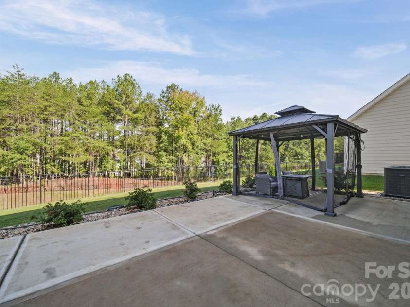 11157 Argosy Drive, Lancaster, SC 29720.  MLS# CAR4410748, YatesRealty ID 44013. Relaxing back yard with nature views with extended concrete