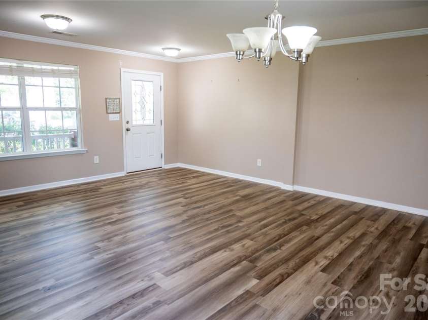 9702 Pond Vista Court, Charlotte, NC 28216.  MLS# CAR4411625, YatesRealty ID 44031. Entryway into Flex/Dining Room