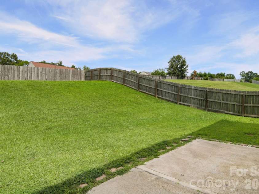 8246 Weeping Fig Lane, Charlotte, NC 28215.  MLS# CAR4413346, YatesRealty ID 44033. Backyard