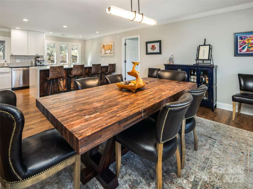173 Glenburnie Lane, Flat Rock, NC 28731.  MLS# CAR4232971, YatesRealty ID 4404. Beautiful Dining Room Table Open to Kitchen