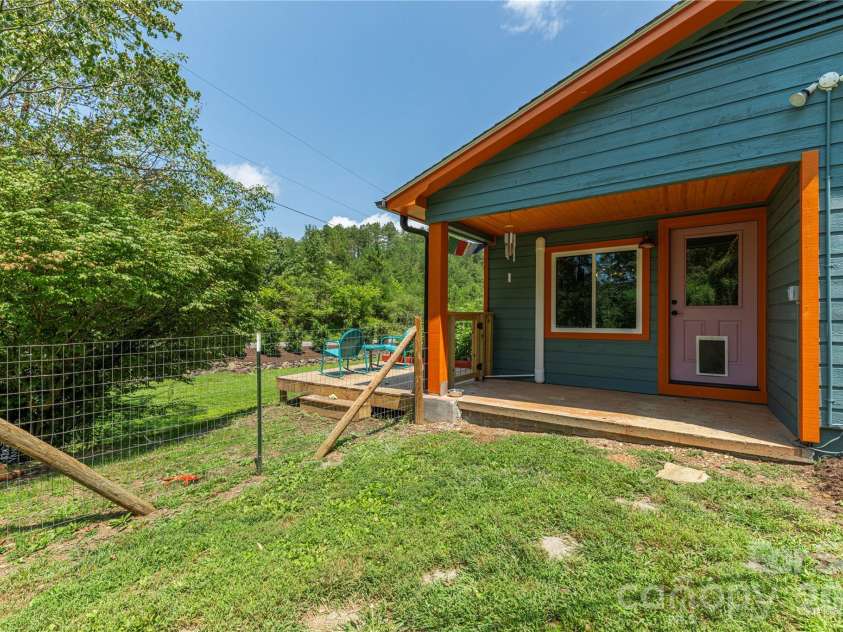 50 Embler Road, Alexander, NC 28701.  MLS# CAR4413083, YatesRealty ID 44048. Covered entrance to dining room