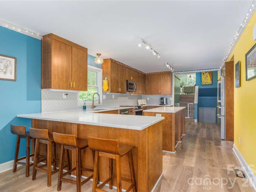 50 Embler Road, Alexander, NC 28701.  MLS# CAR4413083, YatesRealty ID 44048. Kitchen Has Breakfast Bar